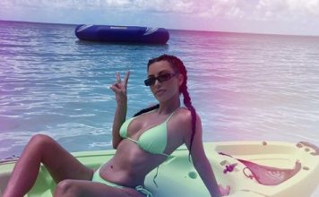 Hollywood star Kim Kardashian gets wet and wild in neon bikini