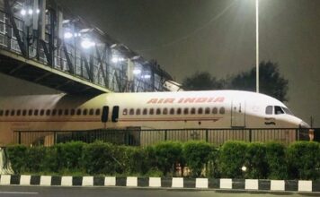 Air India plane gets stuck under foot-over-bridge in Delhi