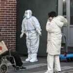China shifts how it counts Covid deaths as crematoriums fill up