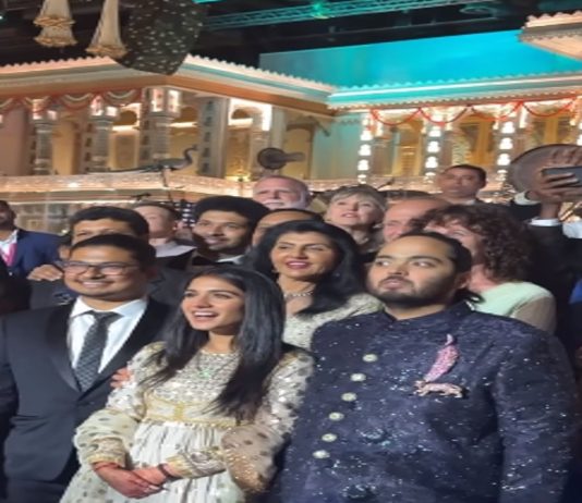 Newly Weds Anant Ambani-Radhika Merchant poses for group pictures with the guests during reception